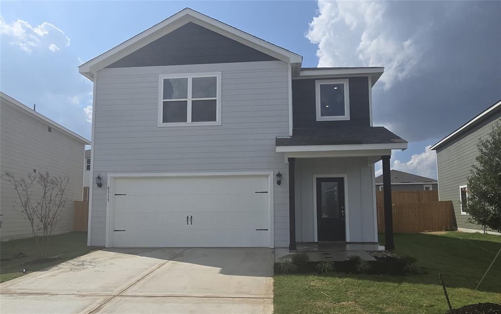 a front view of a house with garage