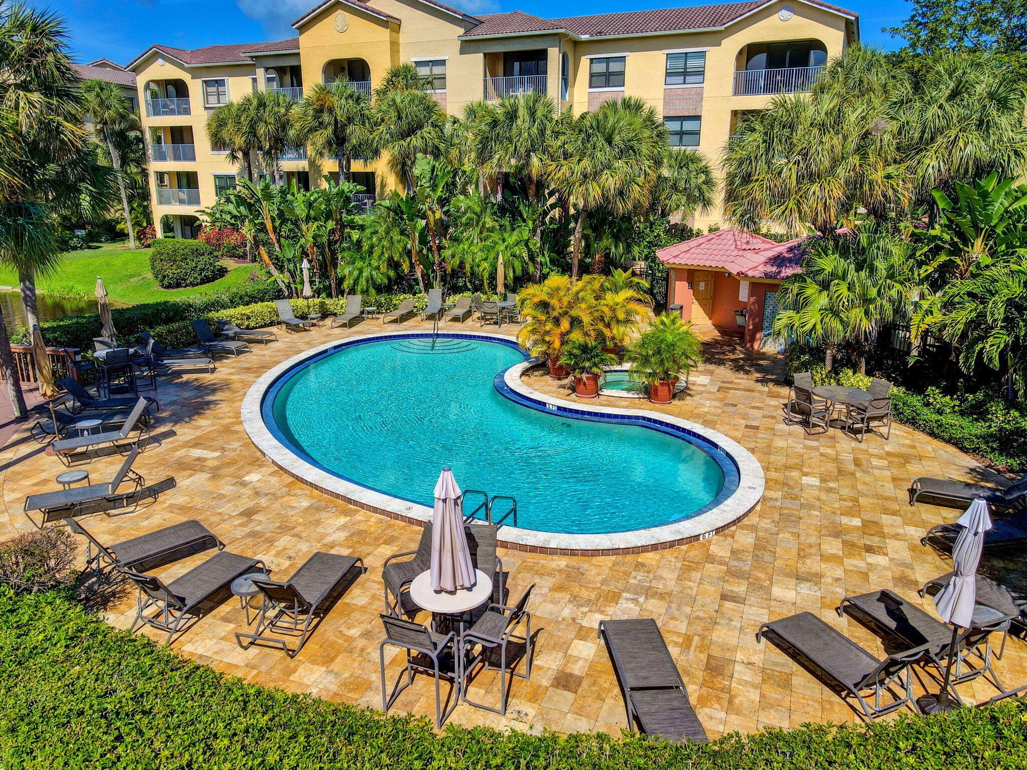 a view of a swimming pool with sitting area