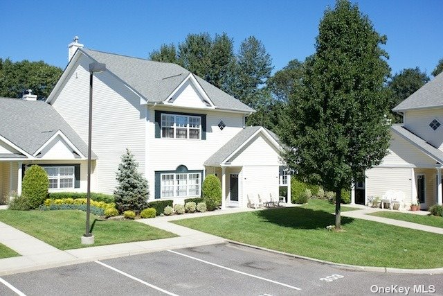 a view of a yard in front view of a house