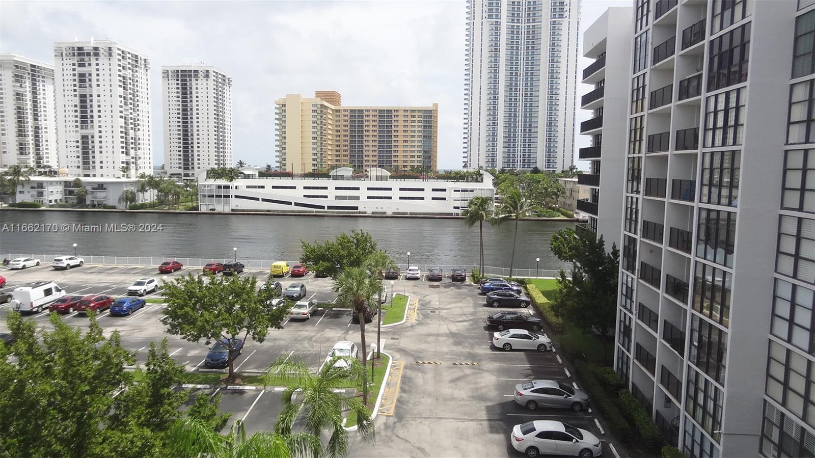 a view of a lake with tall buildings