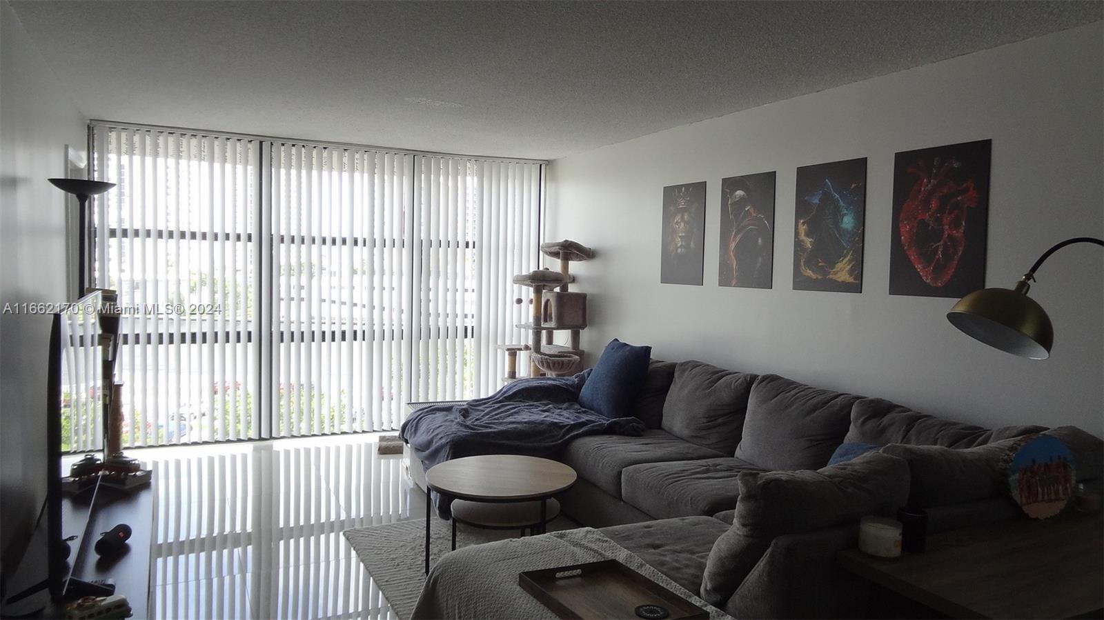 a living room with furniture and a window