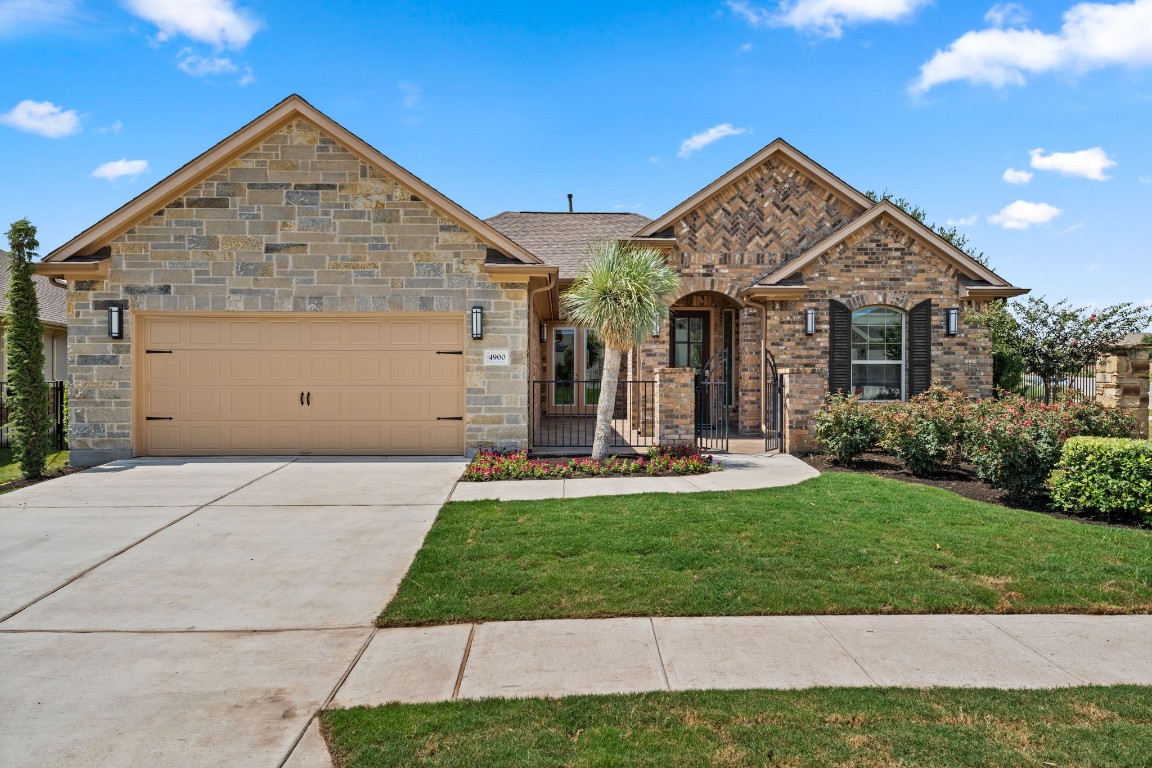 a front view of a house with yard