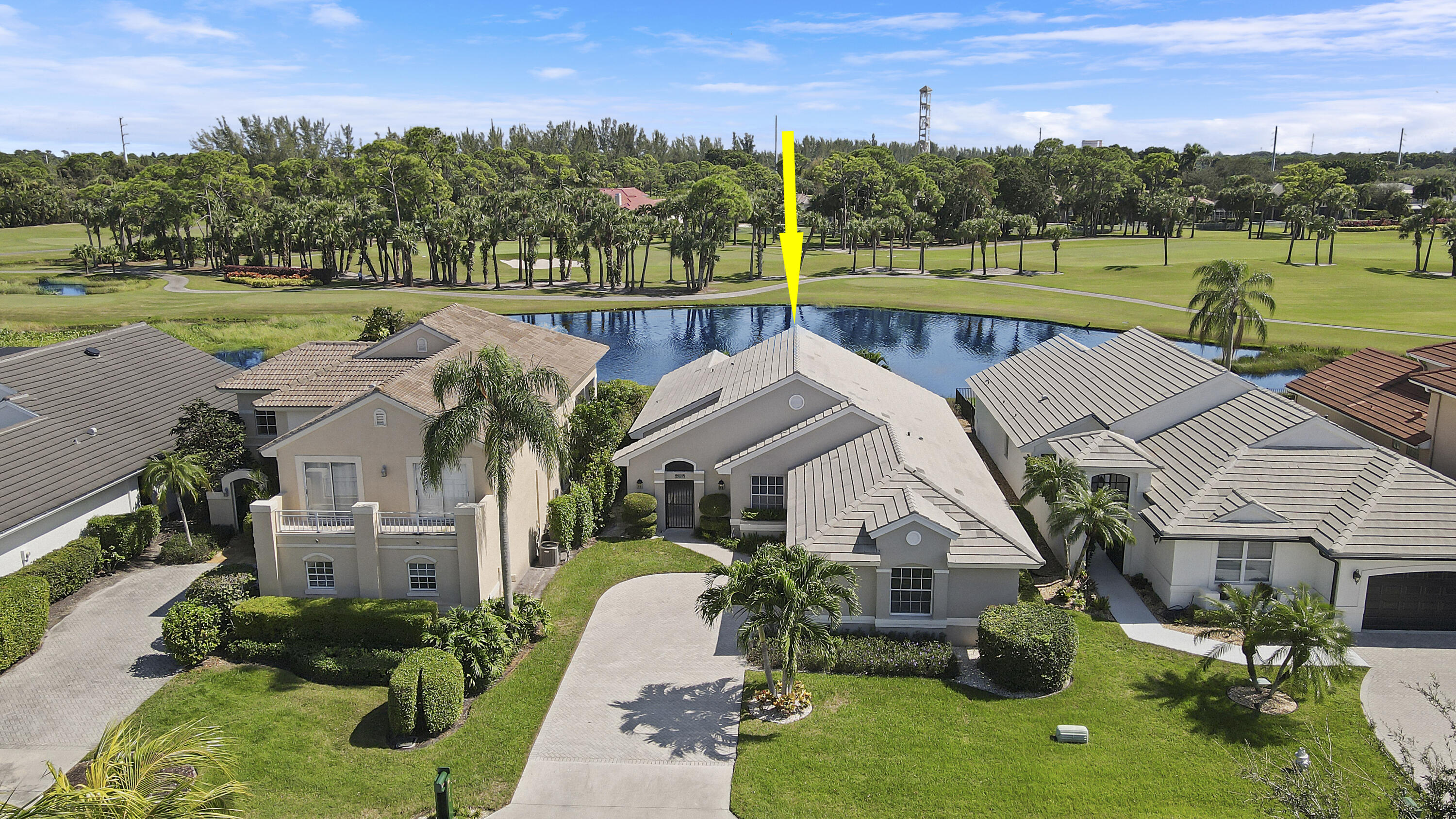 a aerial view of a house with garden and a yard