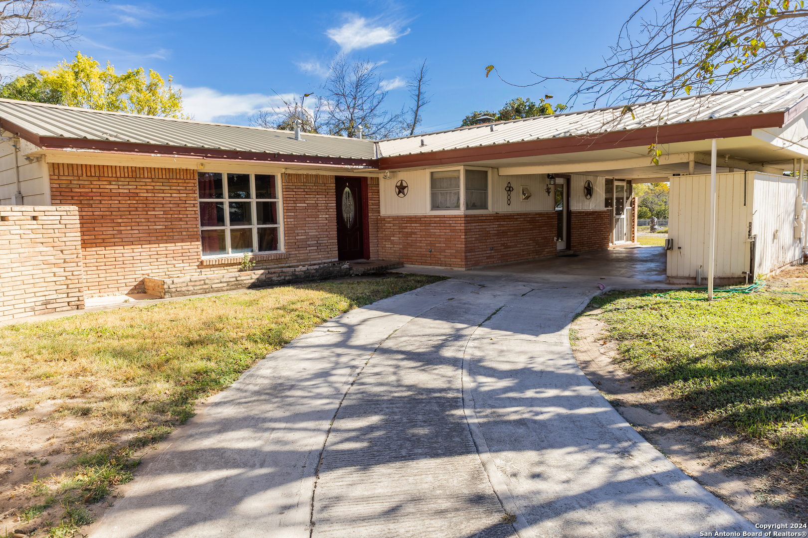 a front view of a house with a patio