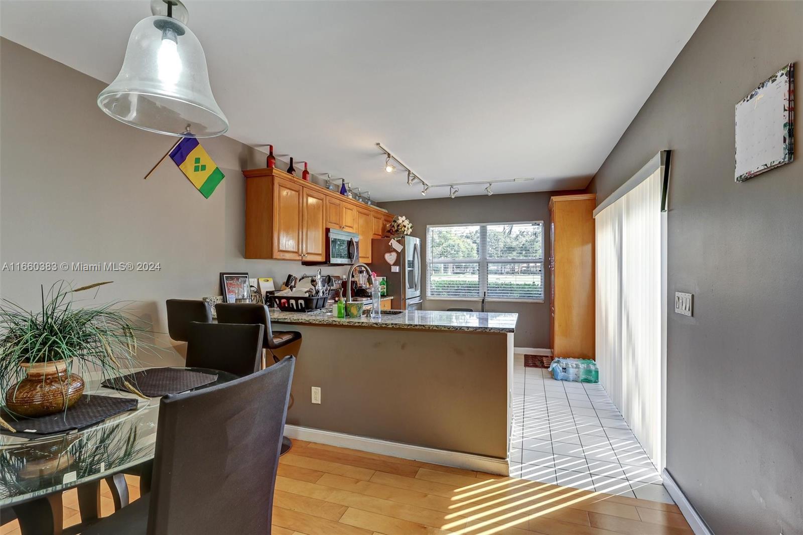 a living room with furniture a window and kitchen view