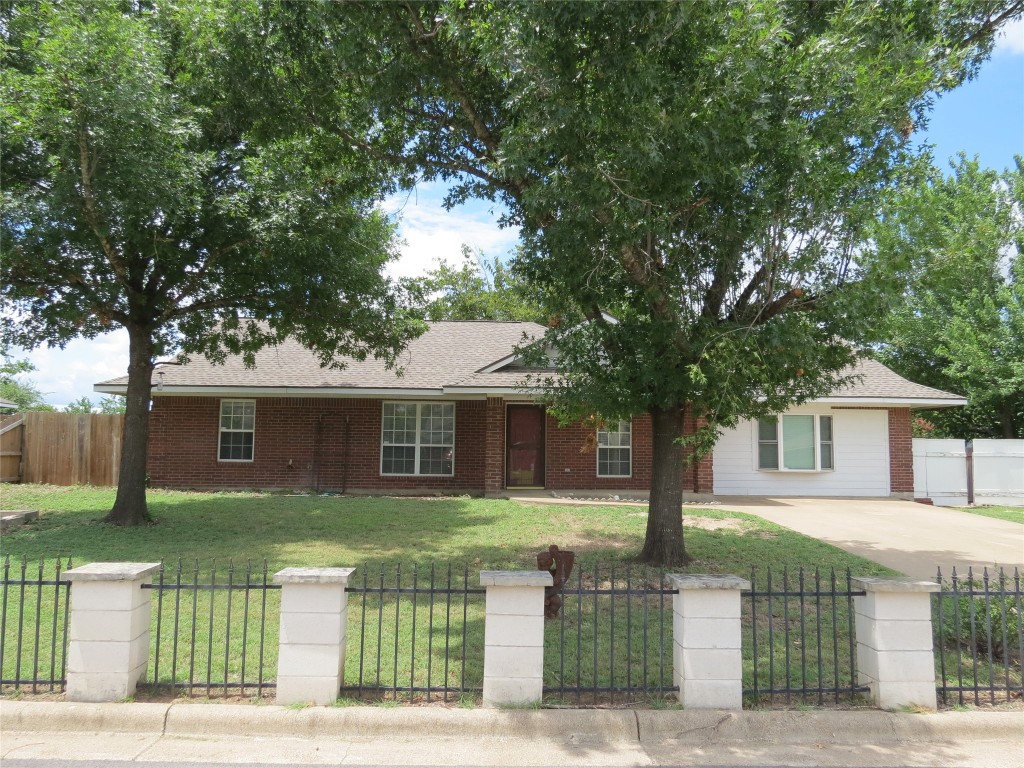 front view of a house with a small yard