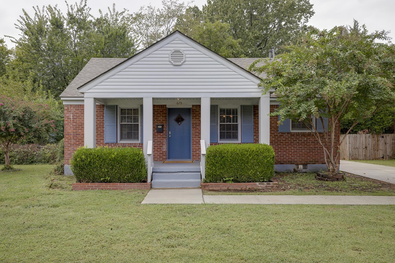 Bungalow-style house with a porch and a front lawn