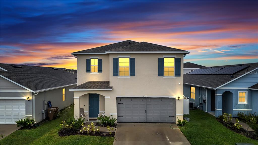 front view of a house with a yard