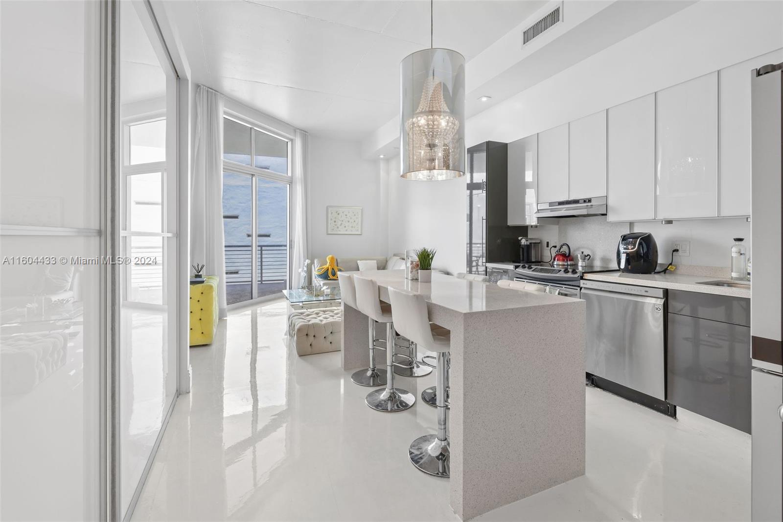 a kitchen with a sink cabinets and window