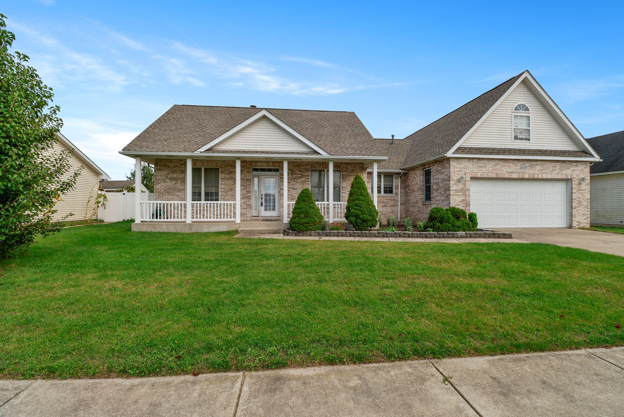 front view of a house with a yard