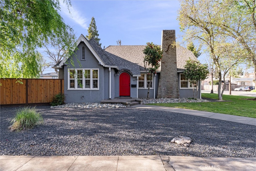 a view of a house with a yard and tree s