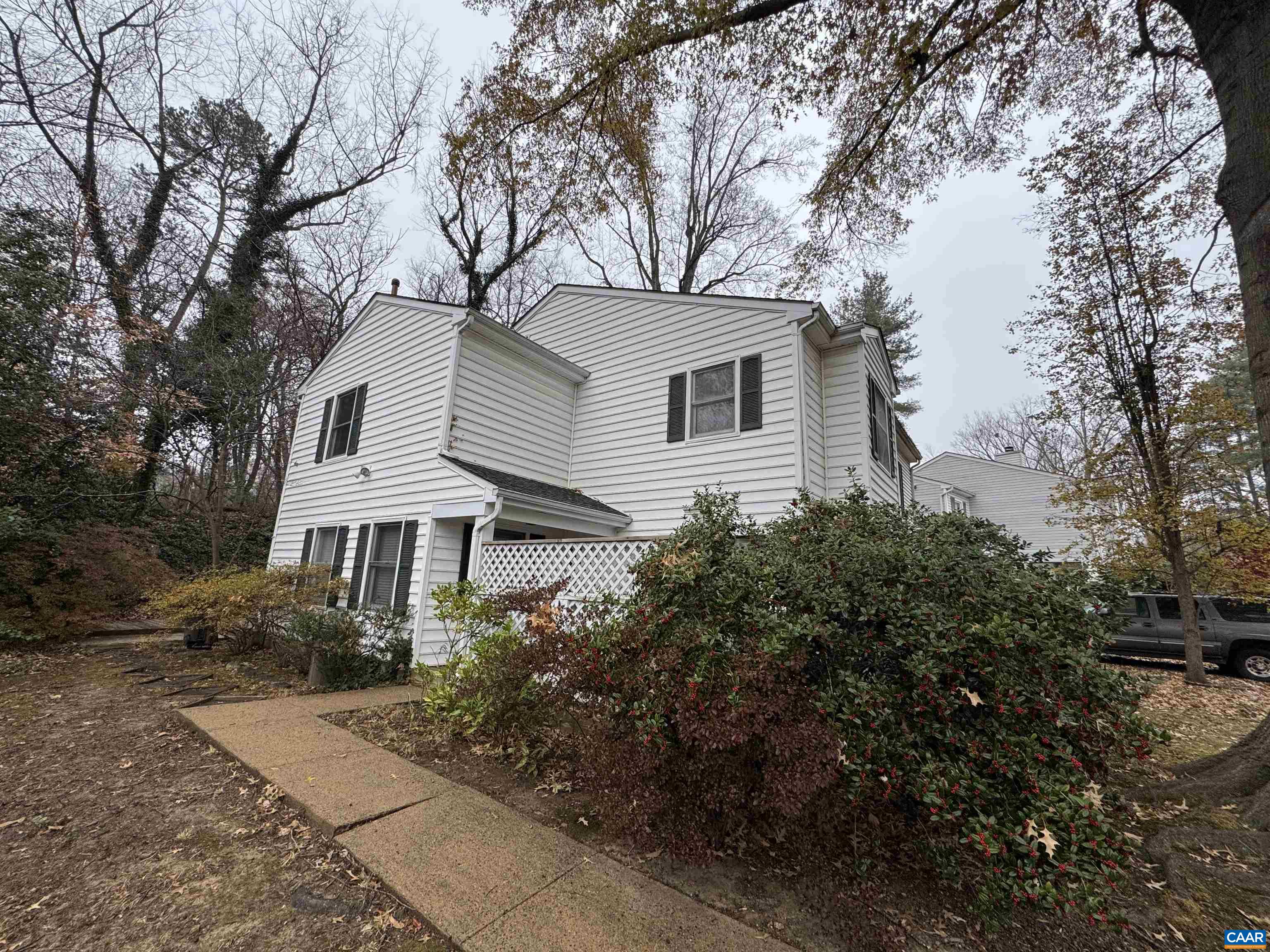 a front view of a house with a garden