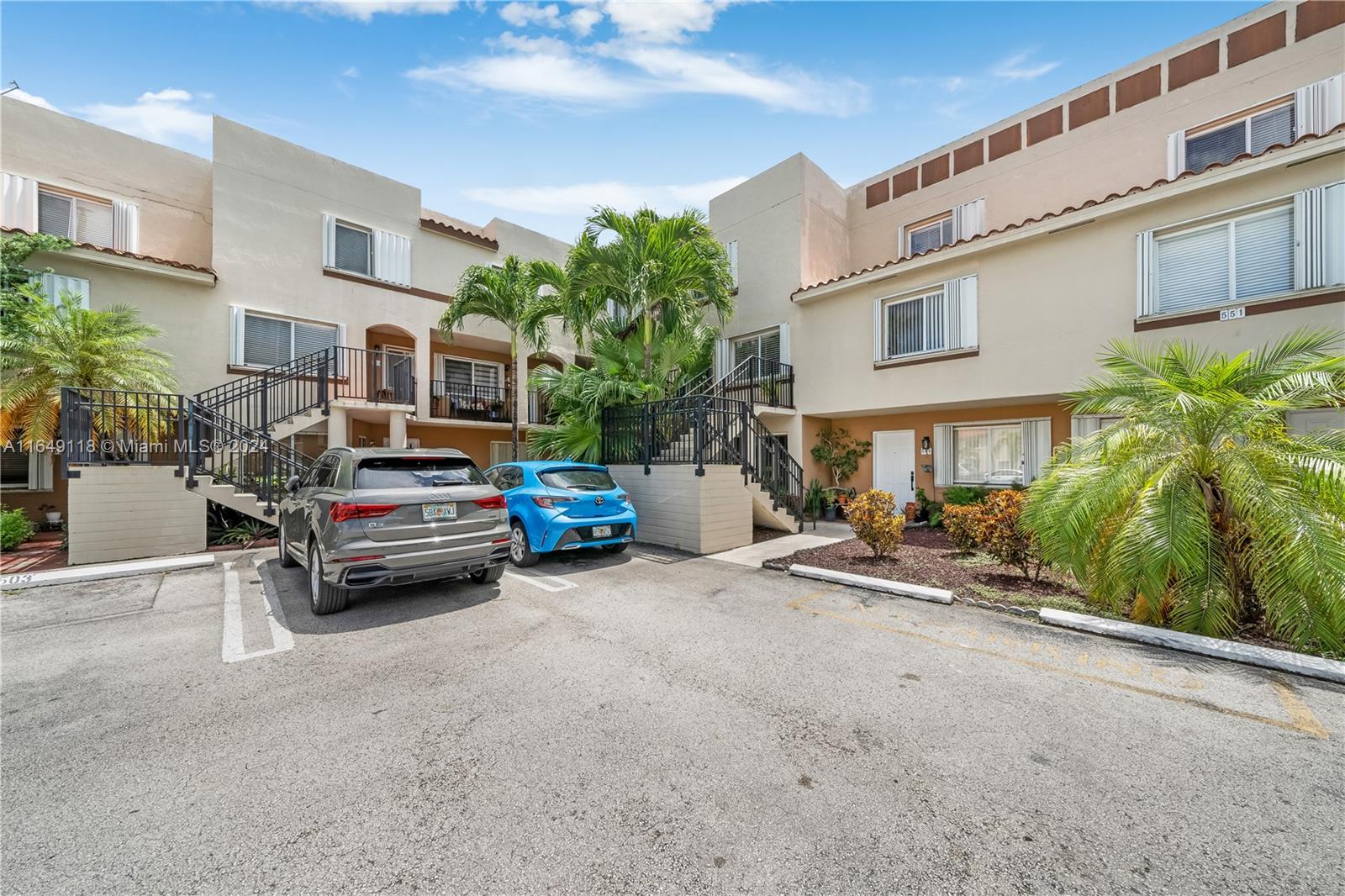 a view of a car park in front of house