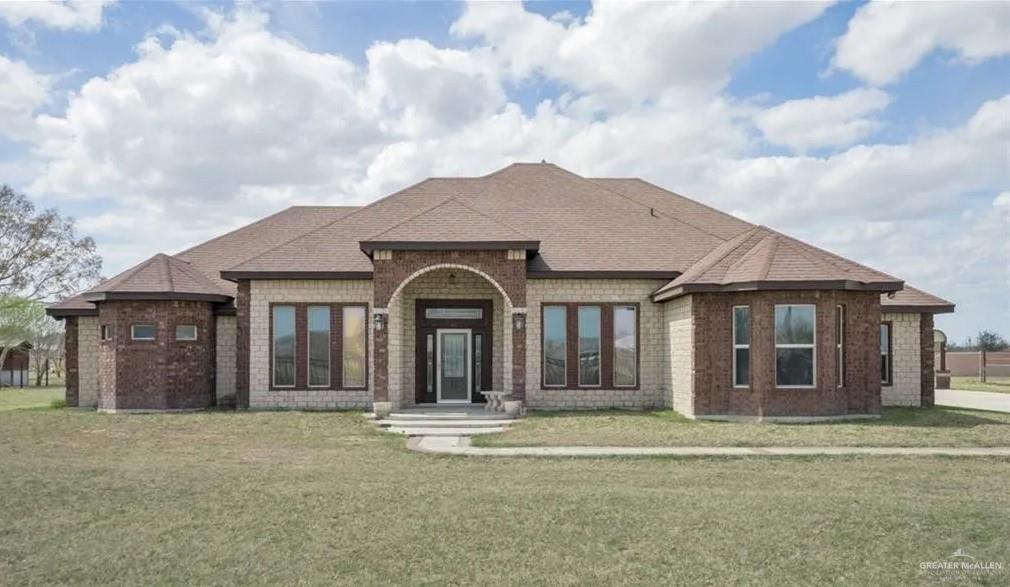 View of front of home featuring a front lawn