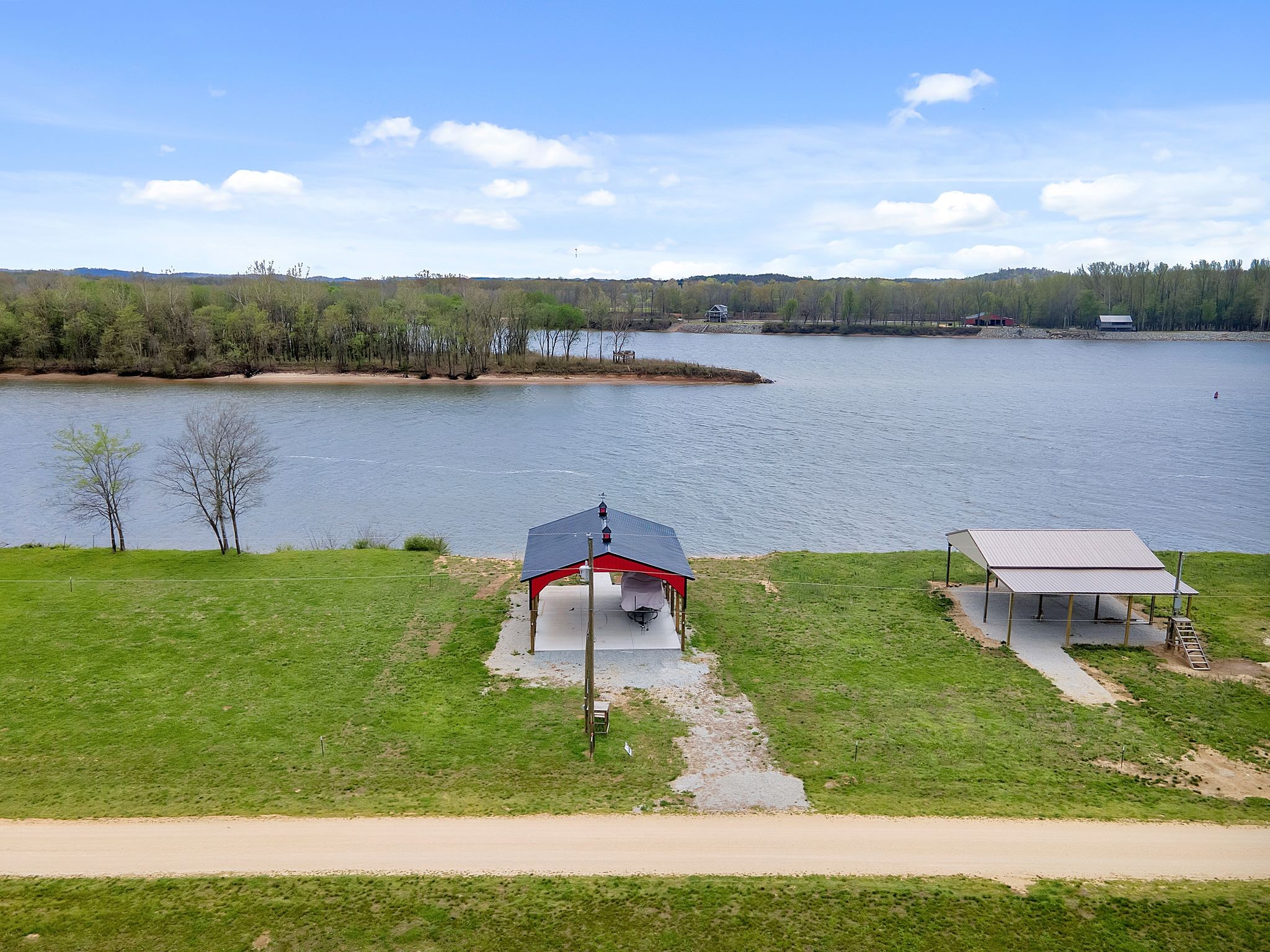 a view of a lake with a yard