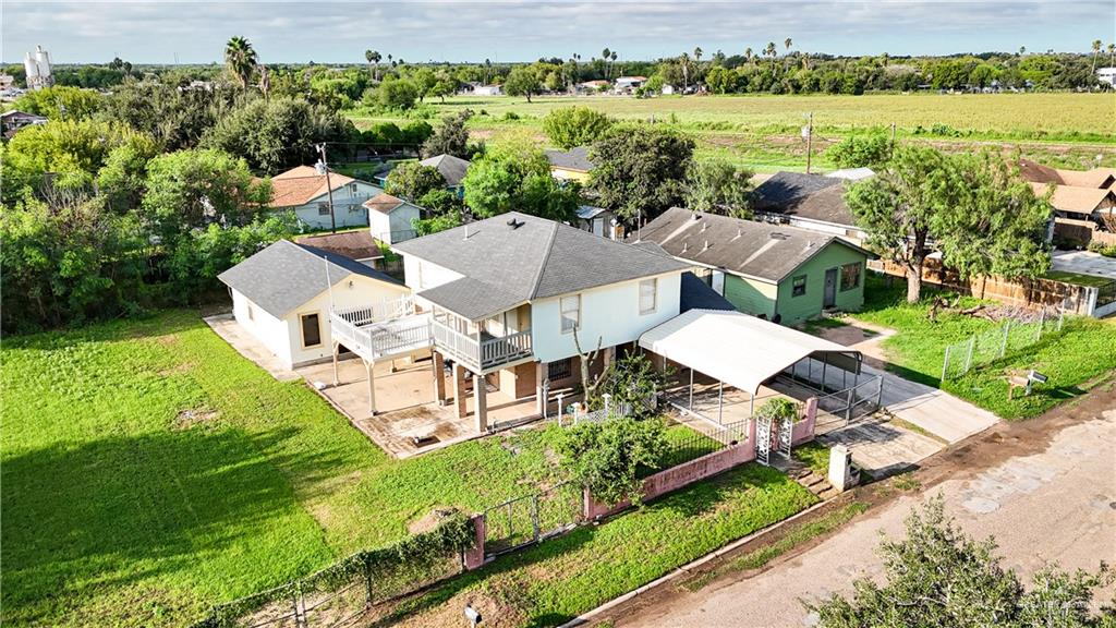 an aerial view of residential house with outdoor space and lake view