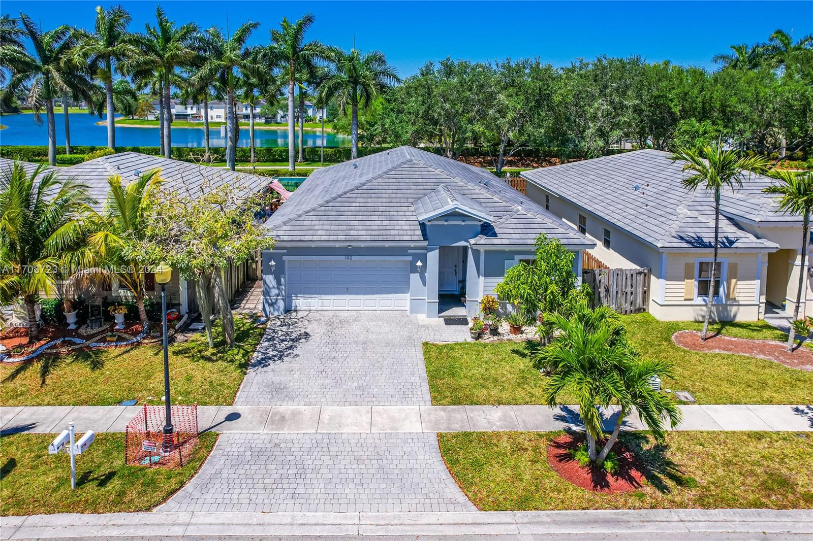 a house with lots of trees in the background