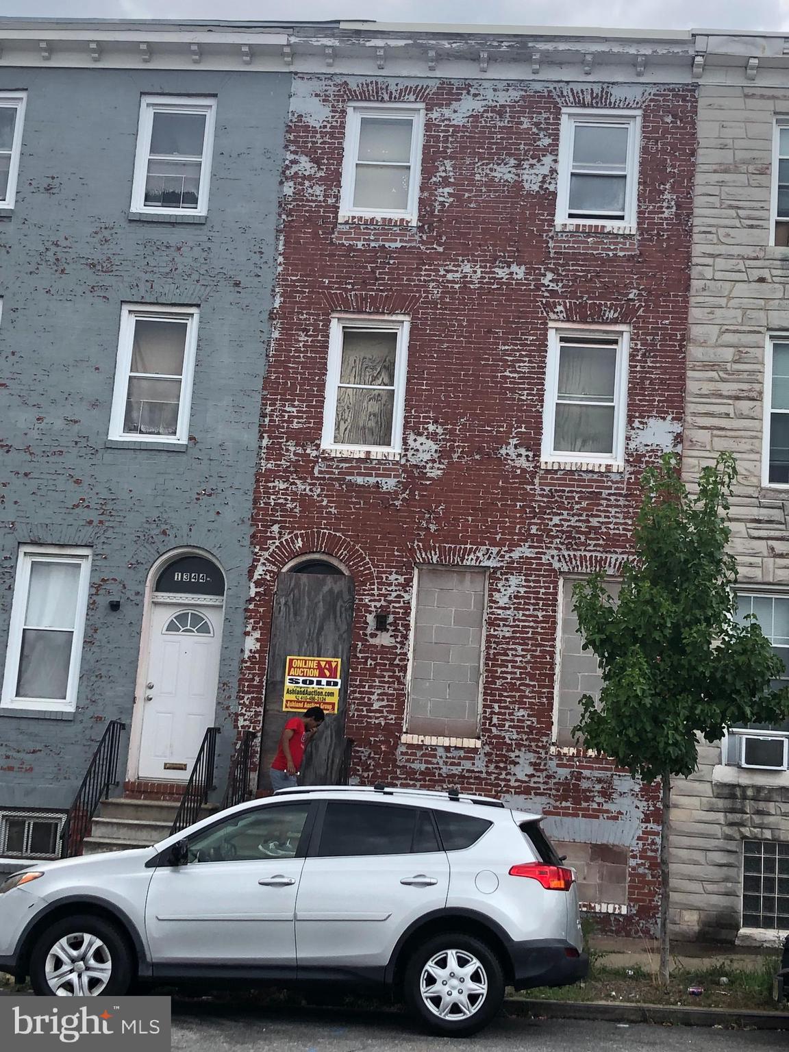 a front view of a house with parking space