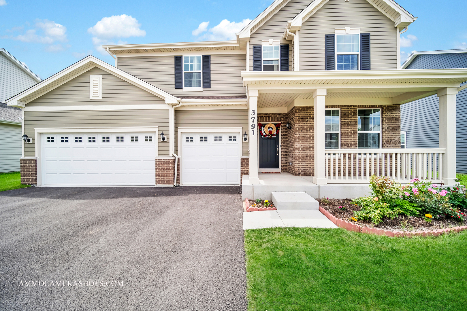 a view of a house with a yard and garage