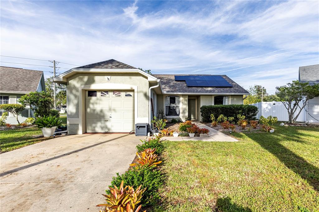 a front view of house with yard having outdoor seating