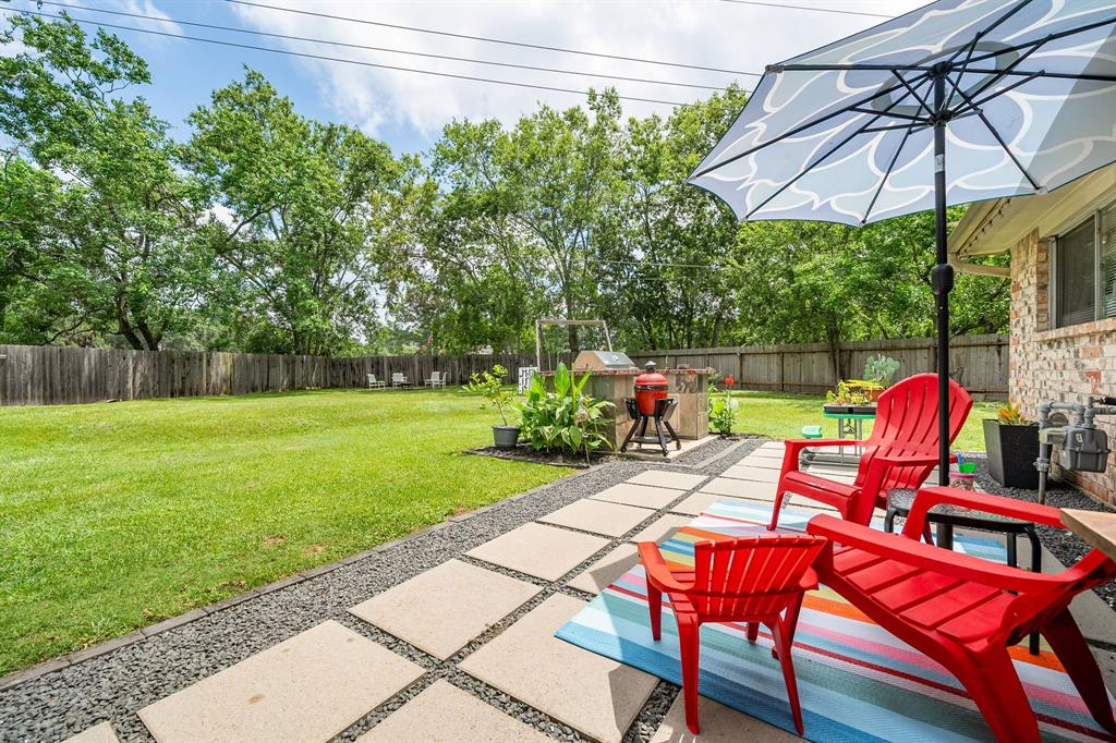 a view of a chairs and table under an umbrella