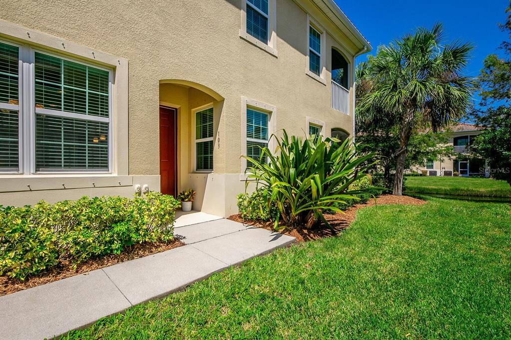 a front view of a house with a yard