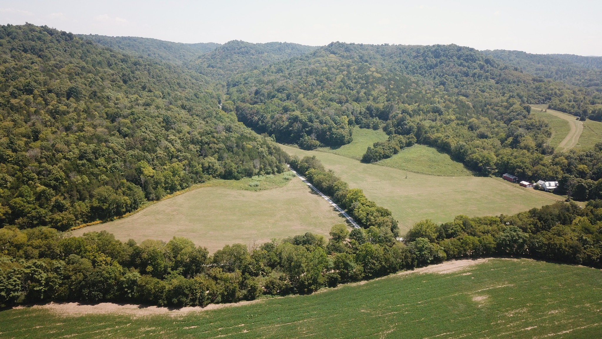 a view of a field with a mountain in the background