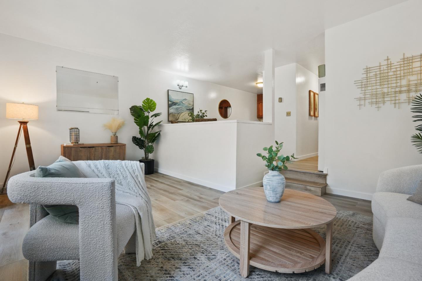 a dining room with furniture and wooden floor