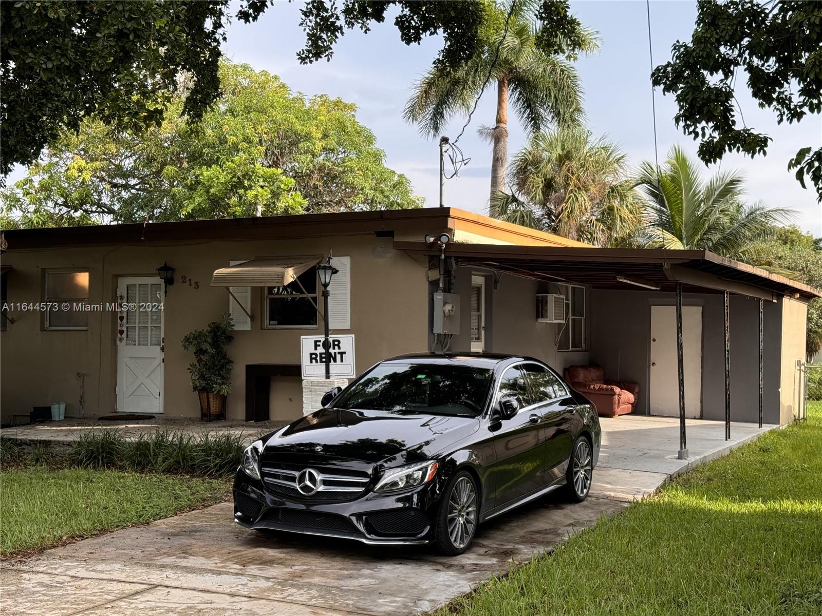 a car parked in front of a house