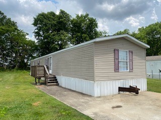 a view of a small house in the back yard