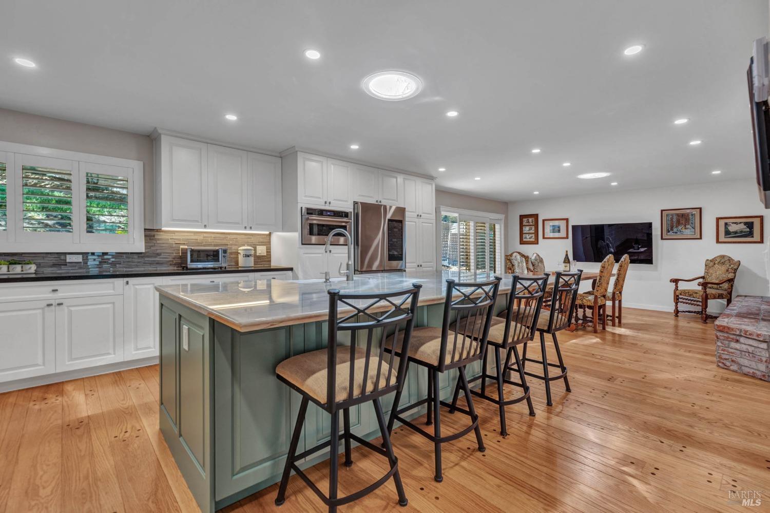 New gorgeous eat-in kitchen, with solid oak flooring.