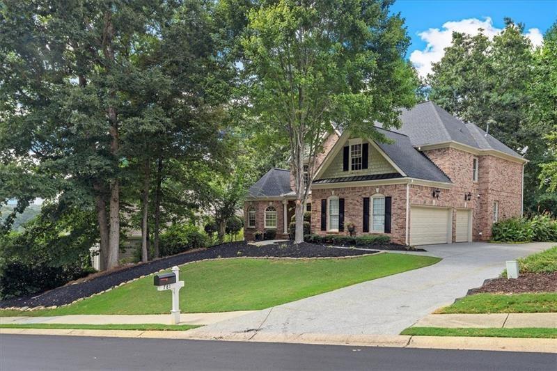 a front view of a house with a yard