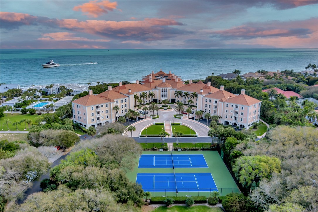 an aerial view of house with yard swimming pool and outdoor seating