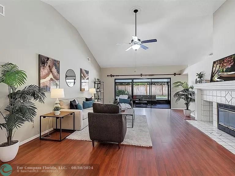 a living room with furniture fireplace and flat screen tv