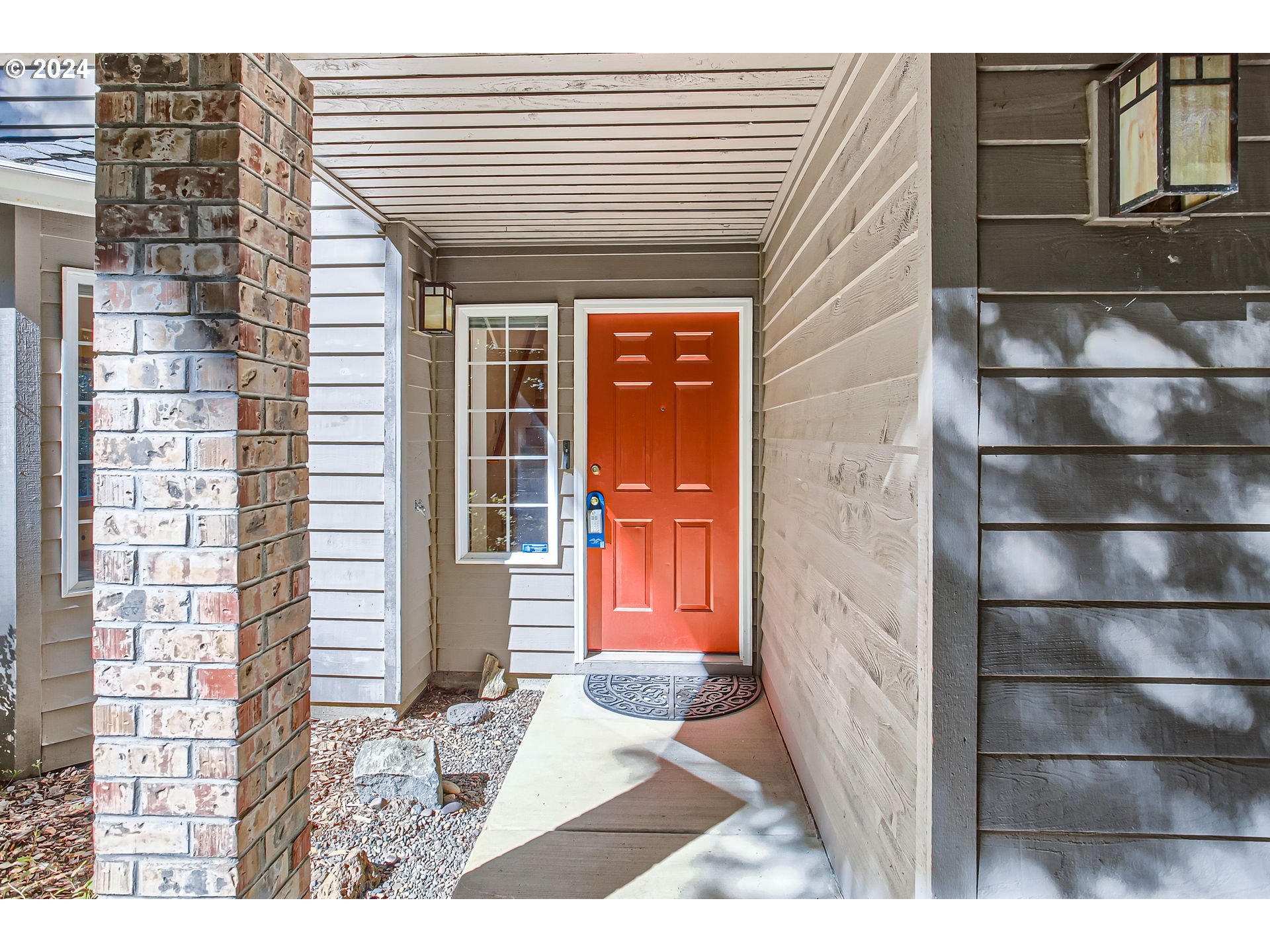 a view of a house with a door and wooden floor