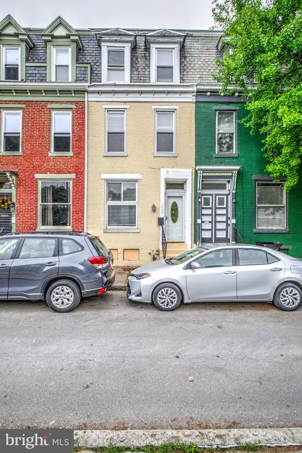 a front view of a house with parking space