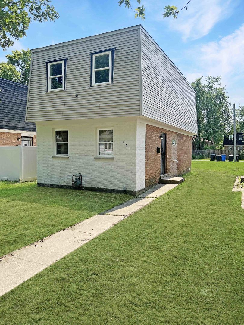 a view of a backyard of the house