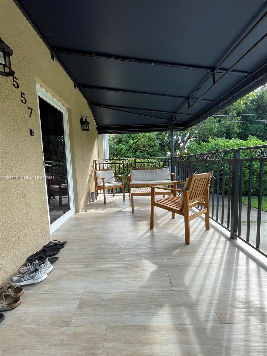 a view of dining room with wooden floor and outdoor seating