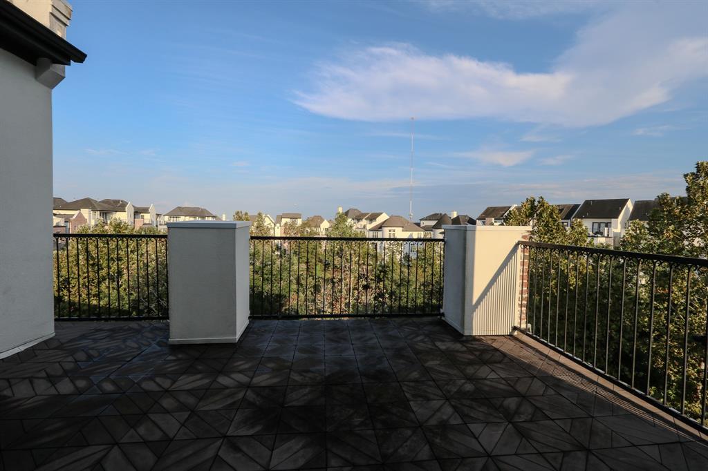 a view of a balcony with city