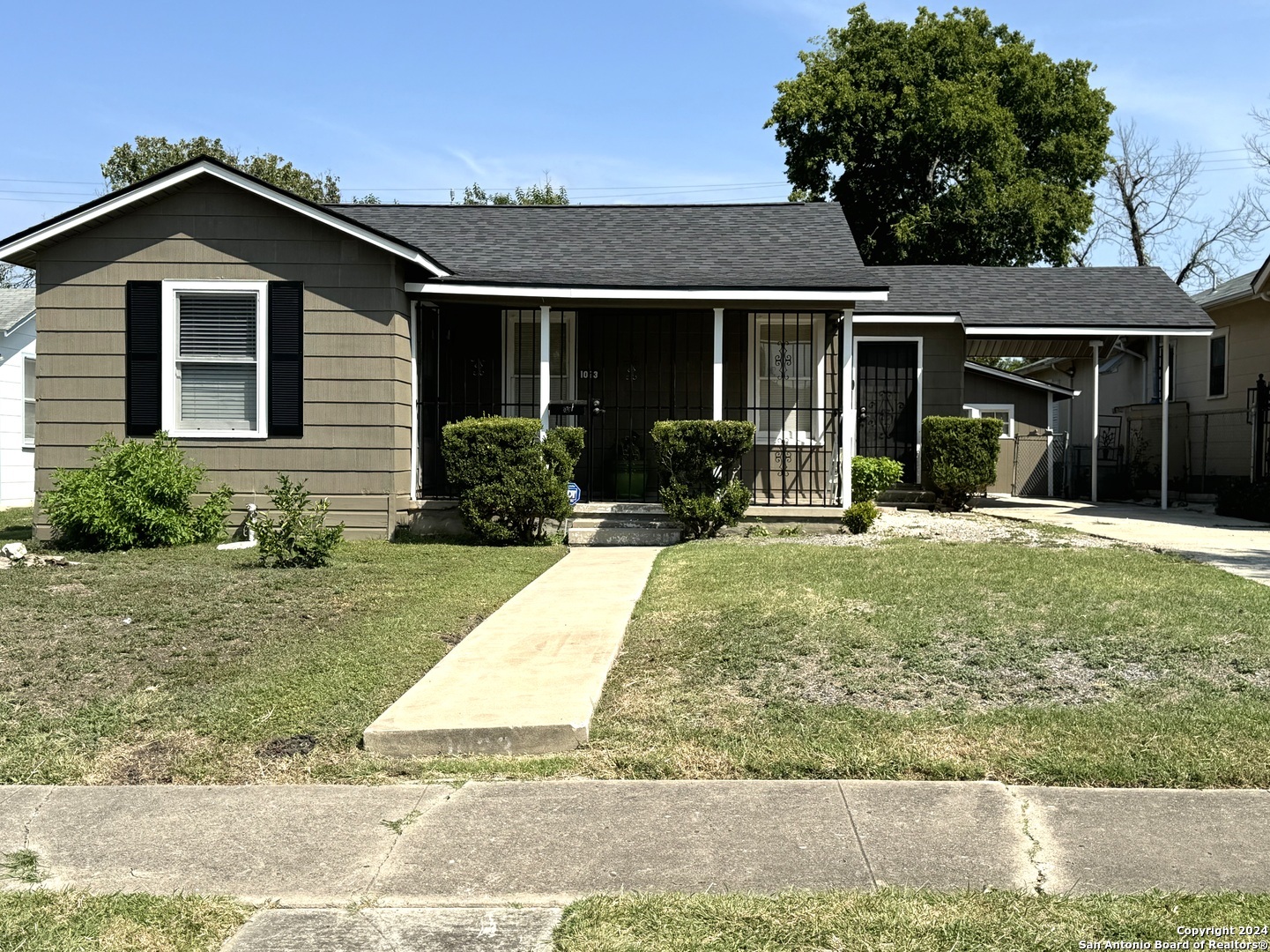 front view of a house with a yard