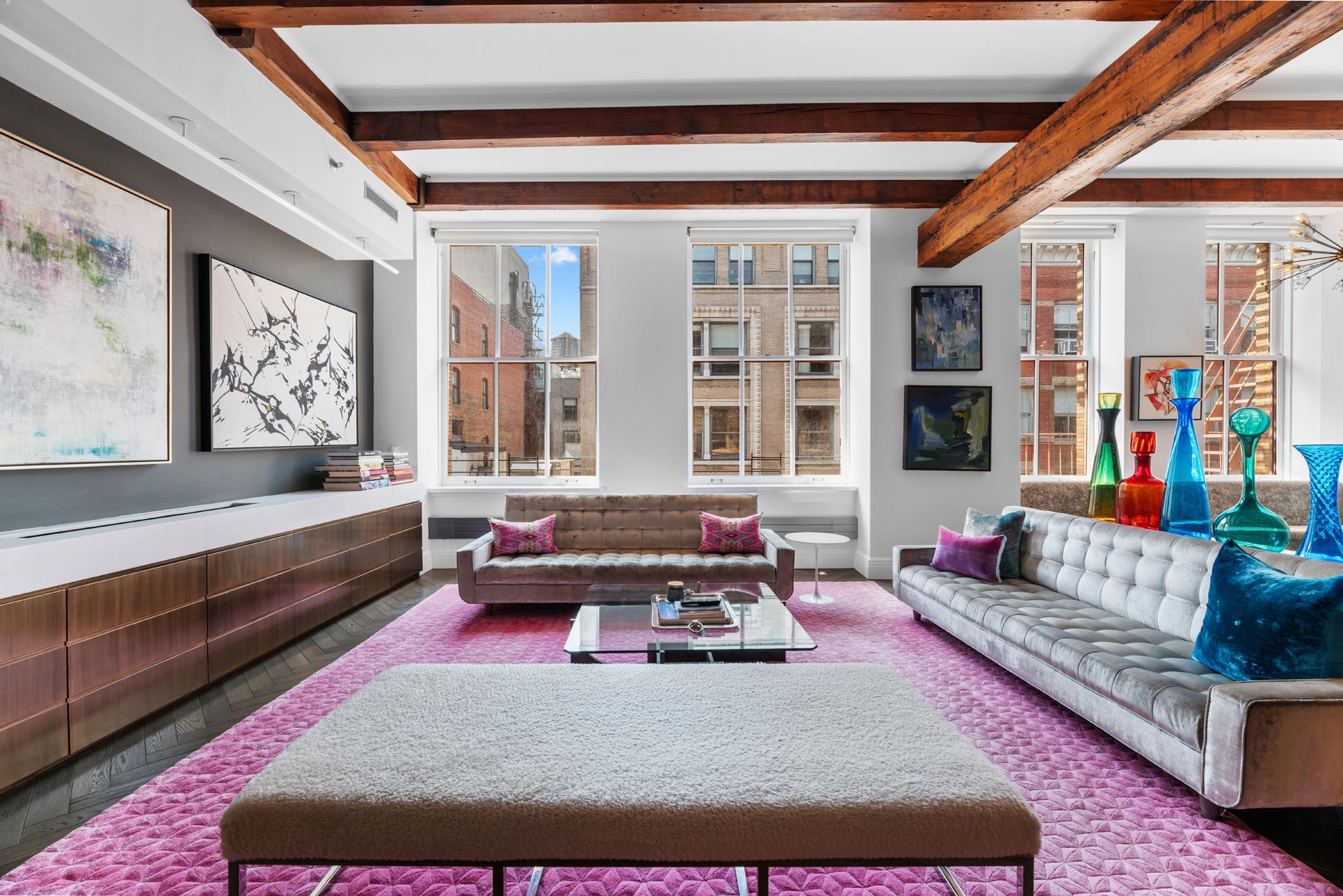 a living room with furniture and a rug