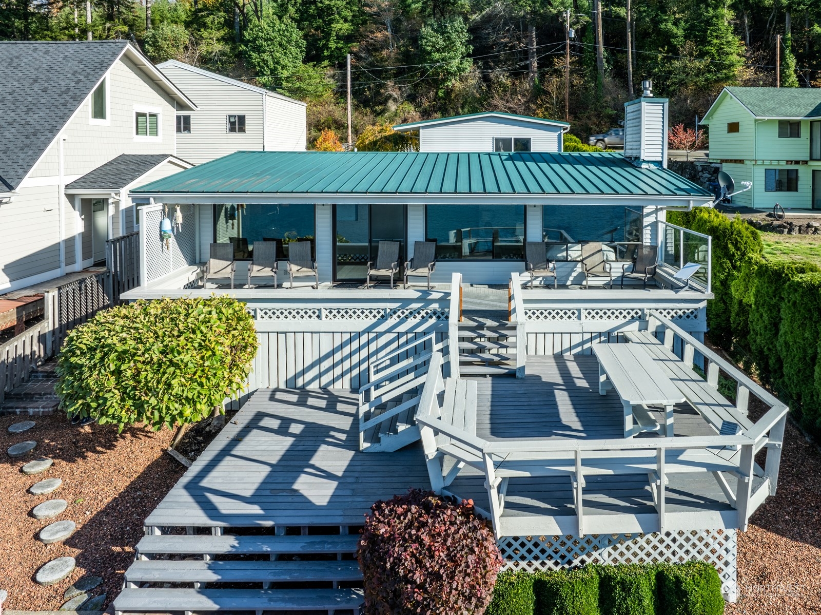 a view of a table and chairs in the patio area of the house