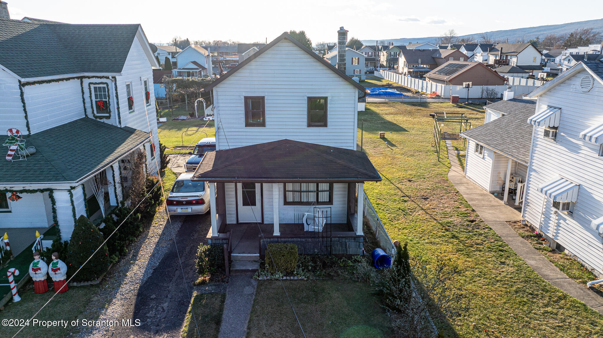 a aerial view of a house with a swimming pool