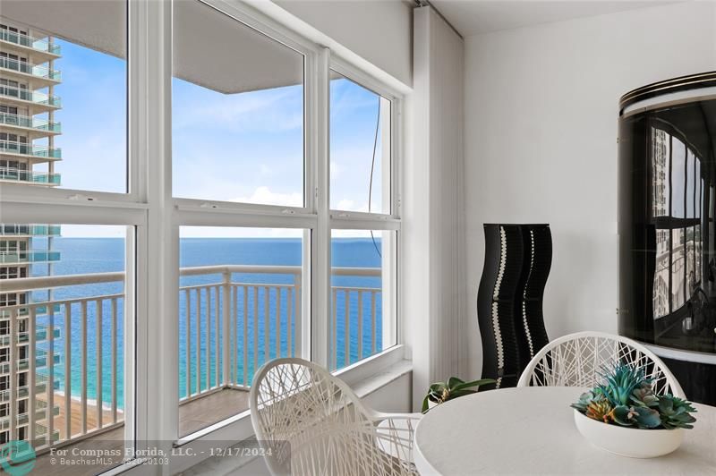 a view of a balcony wooden floor and furniture