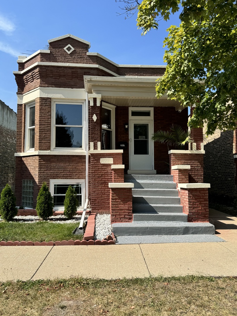 front view of a house with a small yard