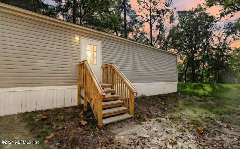 a view of a backyard with a deck