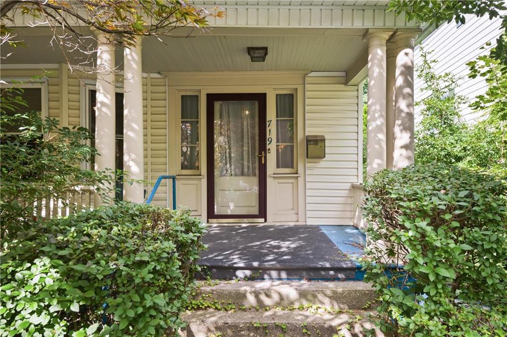 a front view of a house with garden