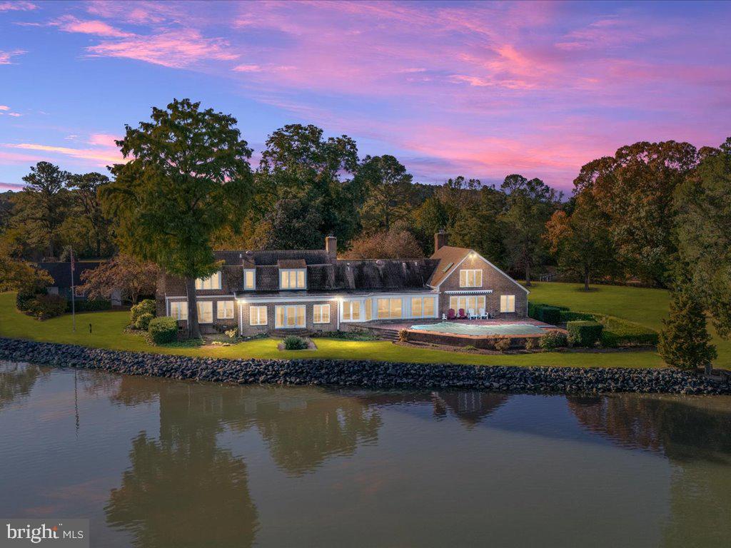 a view of a lake with a house in the background