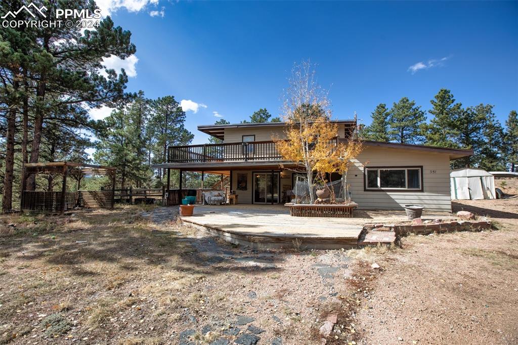 a view of house with outdoor space and sitting area