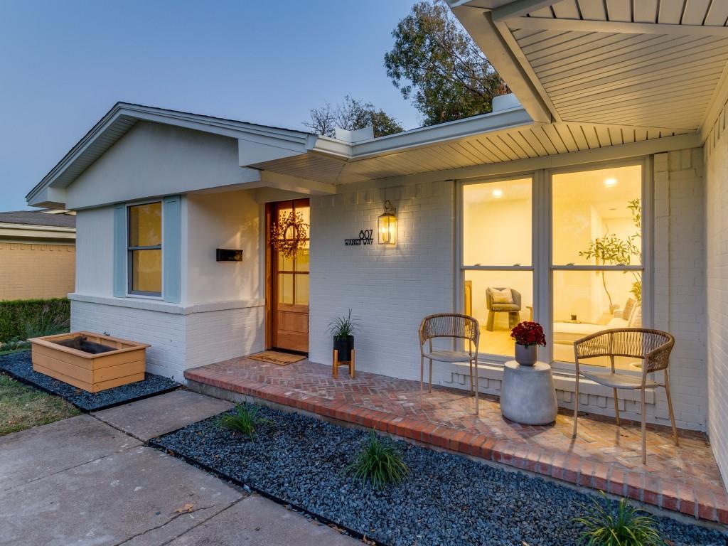 a front view of a house with outdoor seating